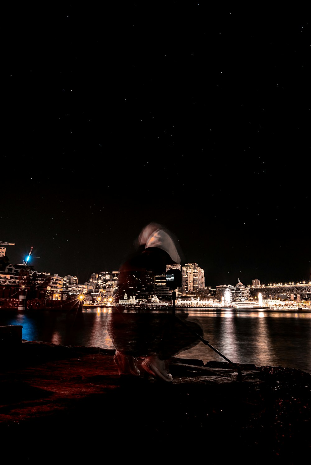 photography of building beside body of water during nighttime