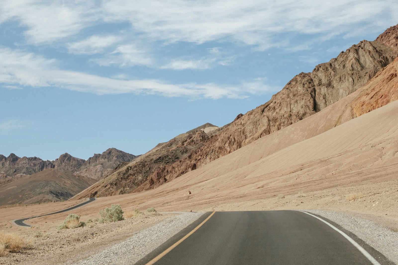 Fujifilm X-T2 + Fujifilm XF 50mm F2 R WR sample photo. Empty road beside rock photography