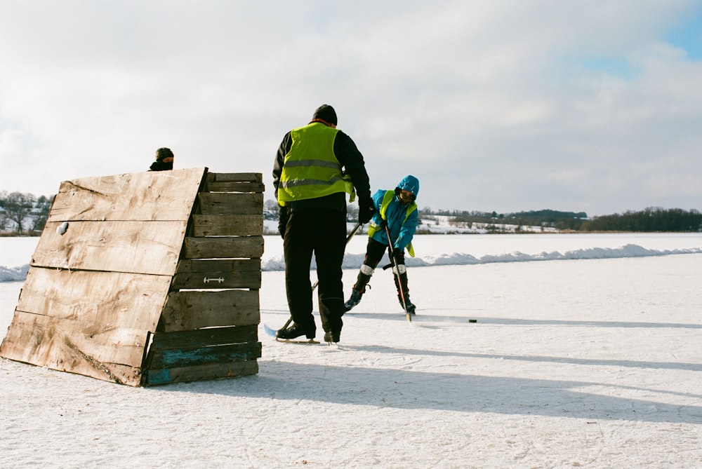 people playing ice hockey during daytime