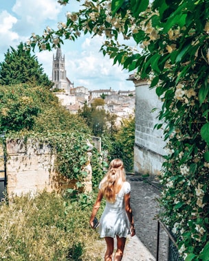 woman walking on road during daytime