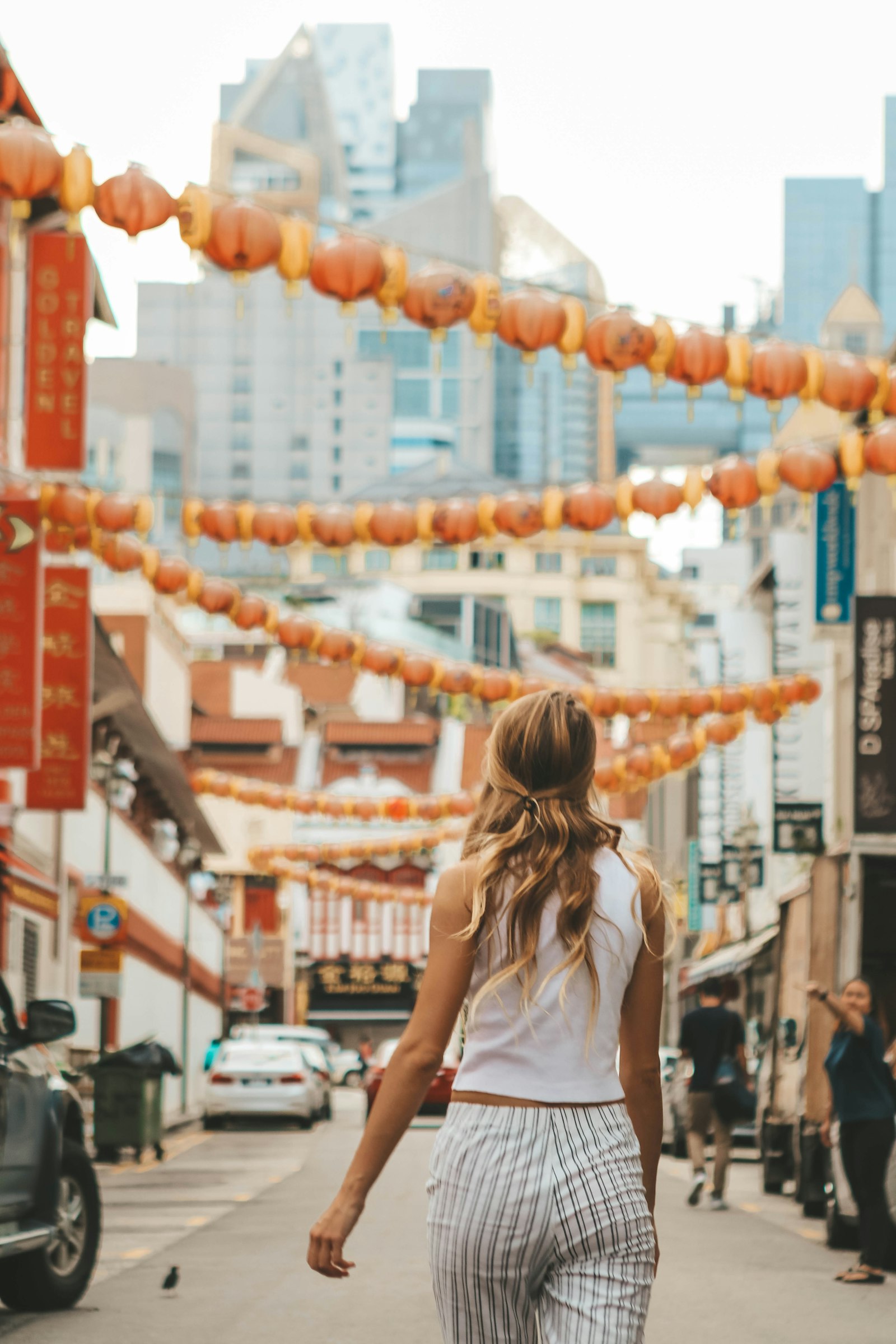 Canon EOS 80D + Canon EF 24-70mm F2.8L USM sample photo. Woman walking along alley photography