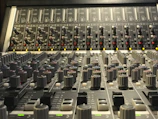 Close-up of high-quality speakers and mixing consoles arranged for a live concert