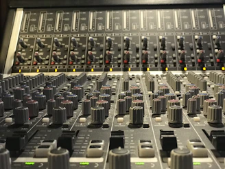 Close-up of professional speakers and mixing console arranged neatly for an event