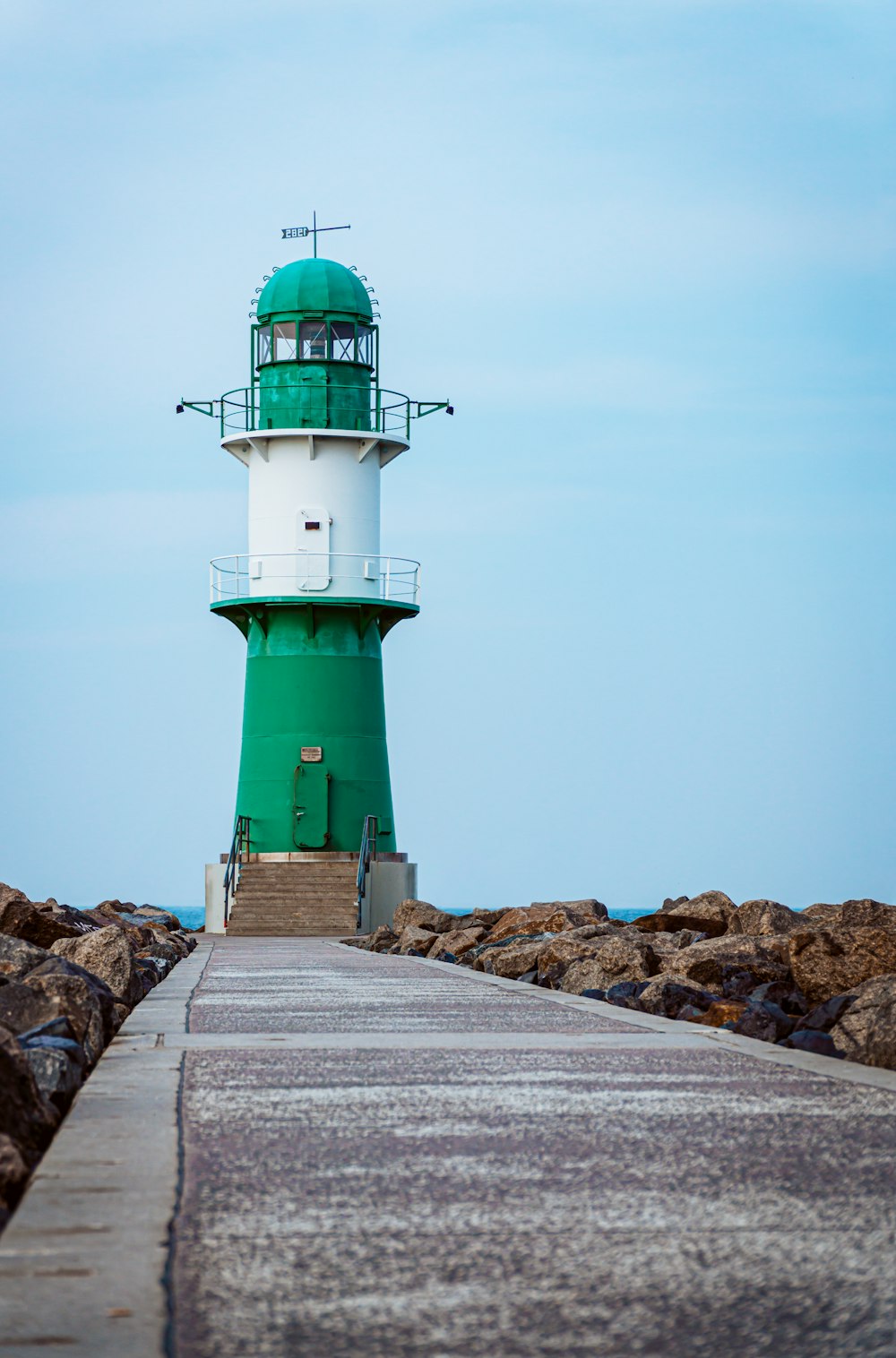 architectural photography of green and white lighthouse