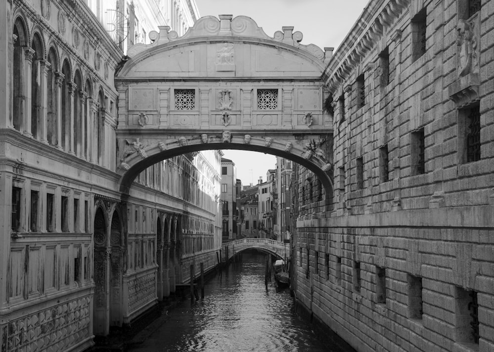 grayscale photo of concrete bridge