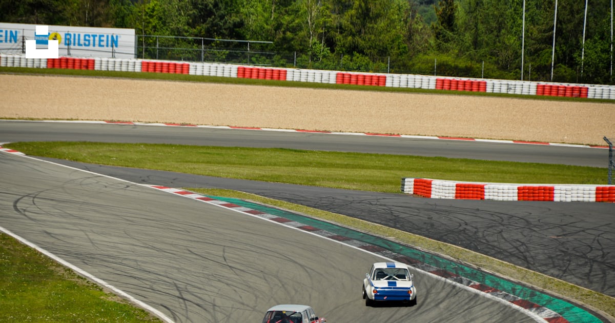 Two racing cars on race track photo – Free Nürburgring Image on Unsplash