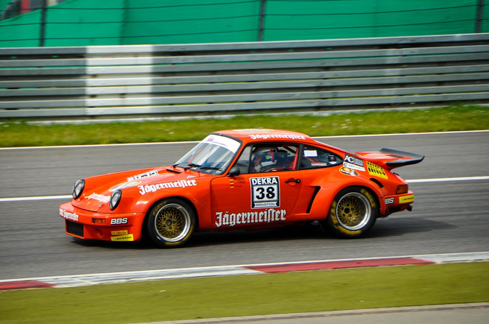 person riding orange coupe