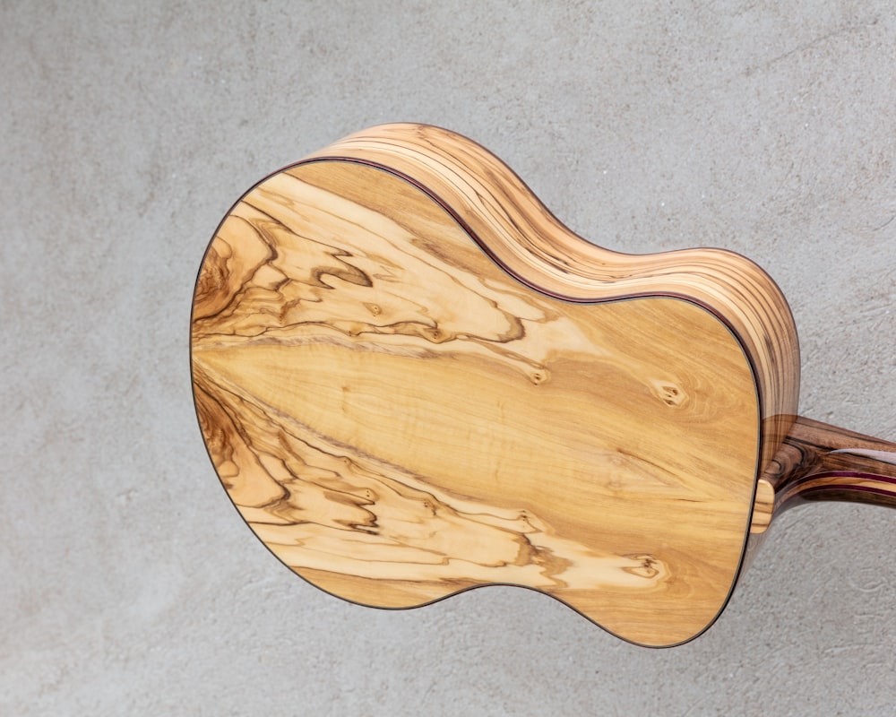 brown wooden dreadnought guitar