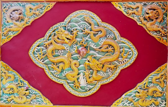 A striking black dragon intertwined with red and gold Asian motifs, surrounded by playing cards and dice.