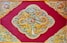 yellow, beige, and red dragon print textile