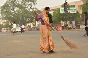 Volunteers cleaning streets during a Swachh Bharat mission drive in Odisha