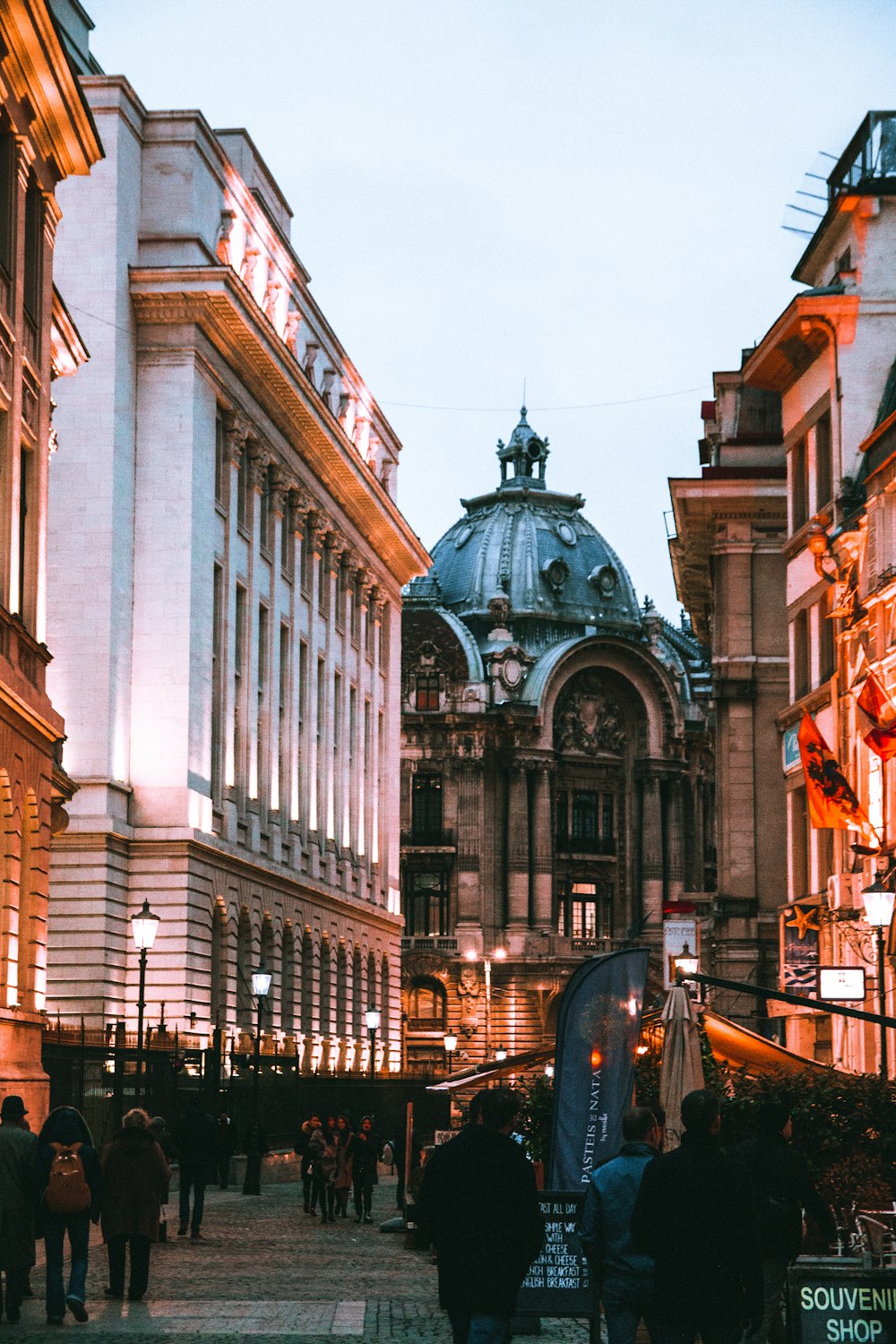 people walking beside buildings