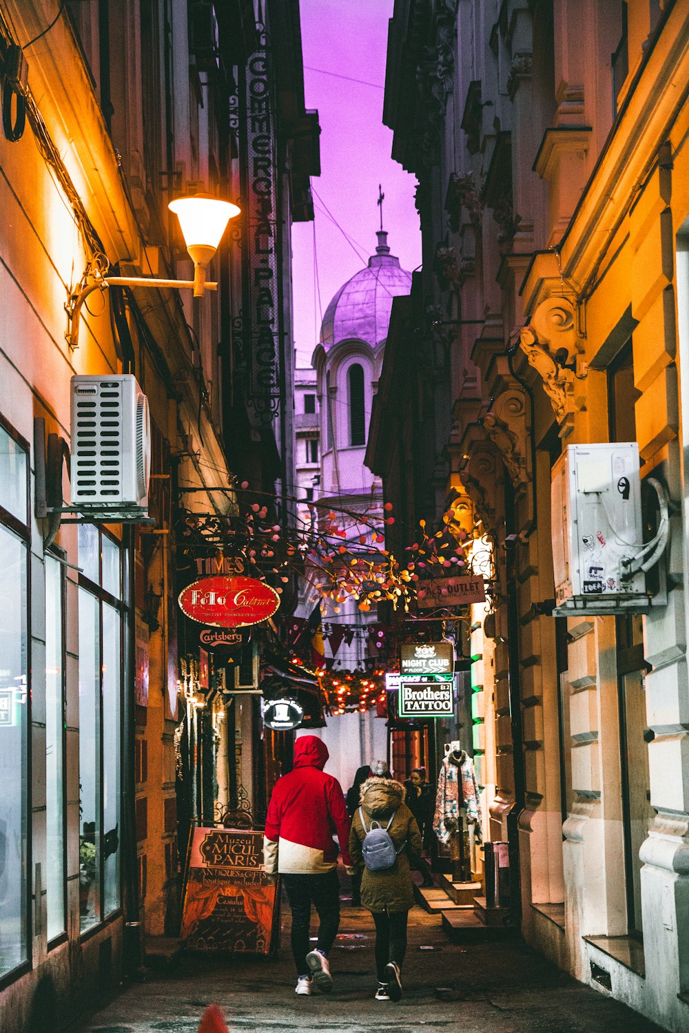 two person walking in hallway