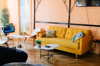 yellow sofa near wall