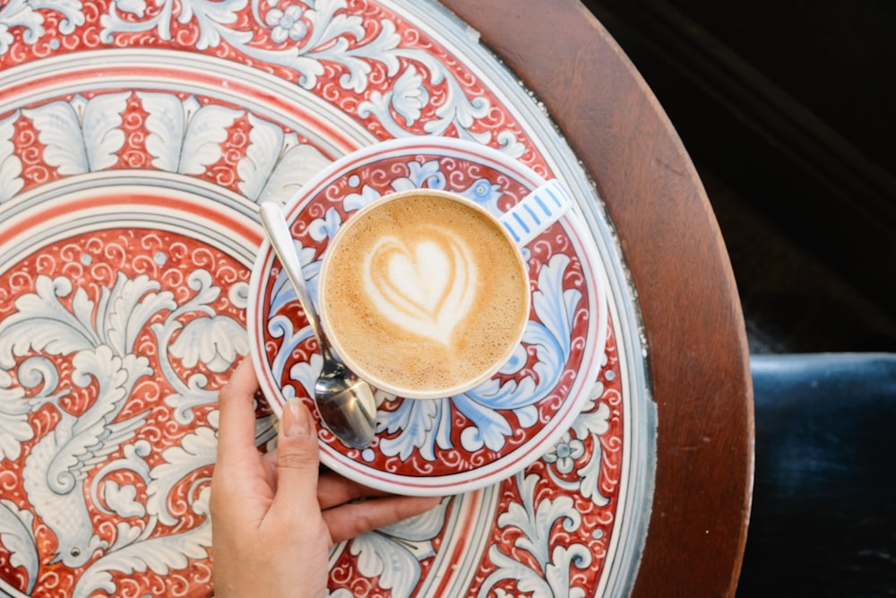 person holding espresso cup