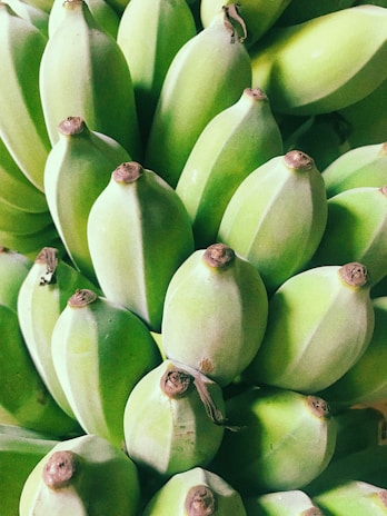 Close-up of ripe mangoes and bananas freshly packed for delivery.