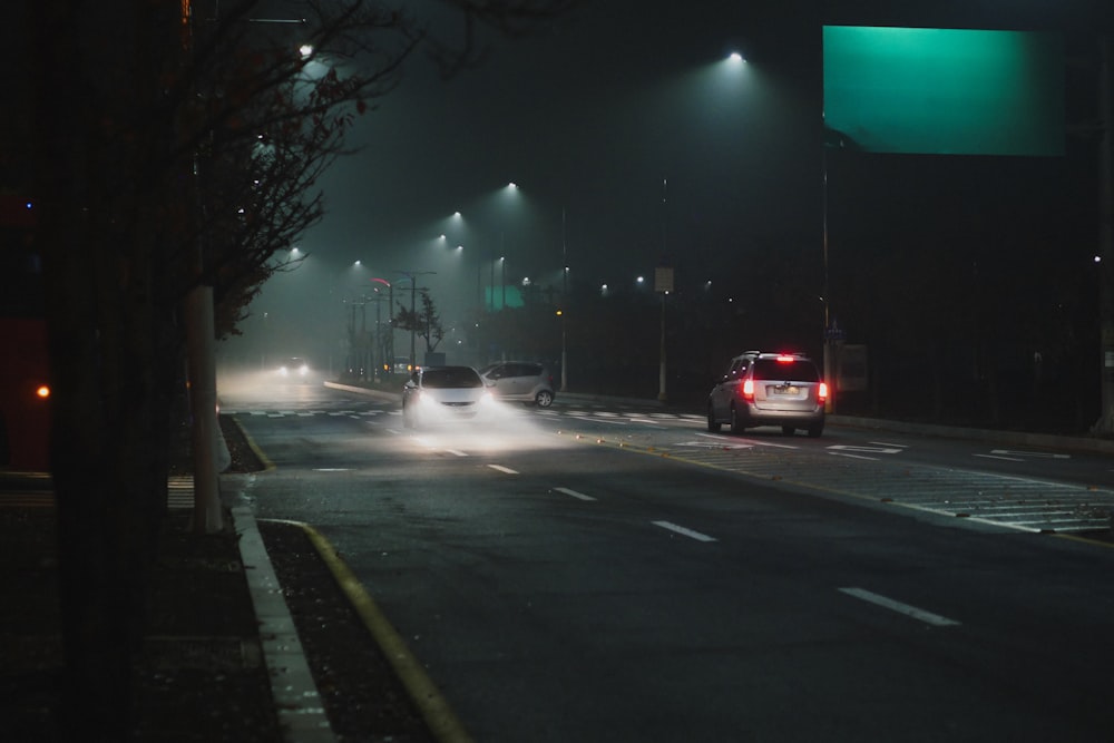 white vehicle in road during nighttime