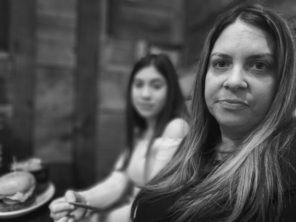 grayscale photography of two women