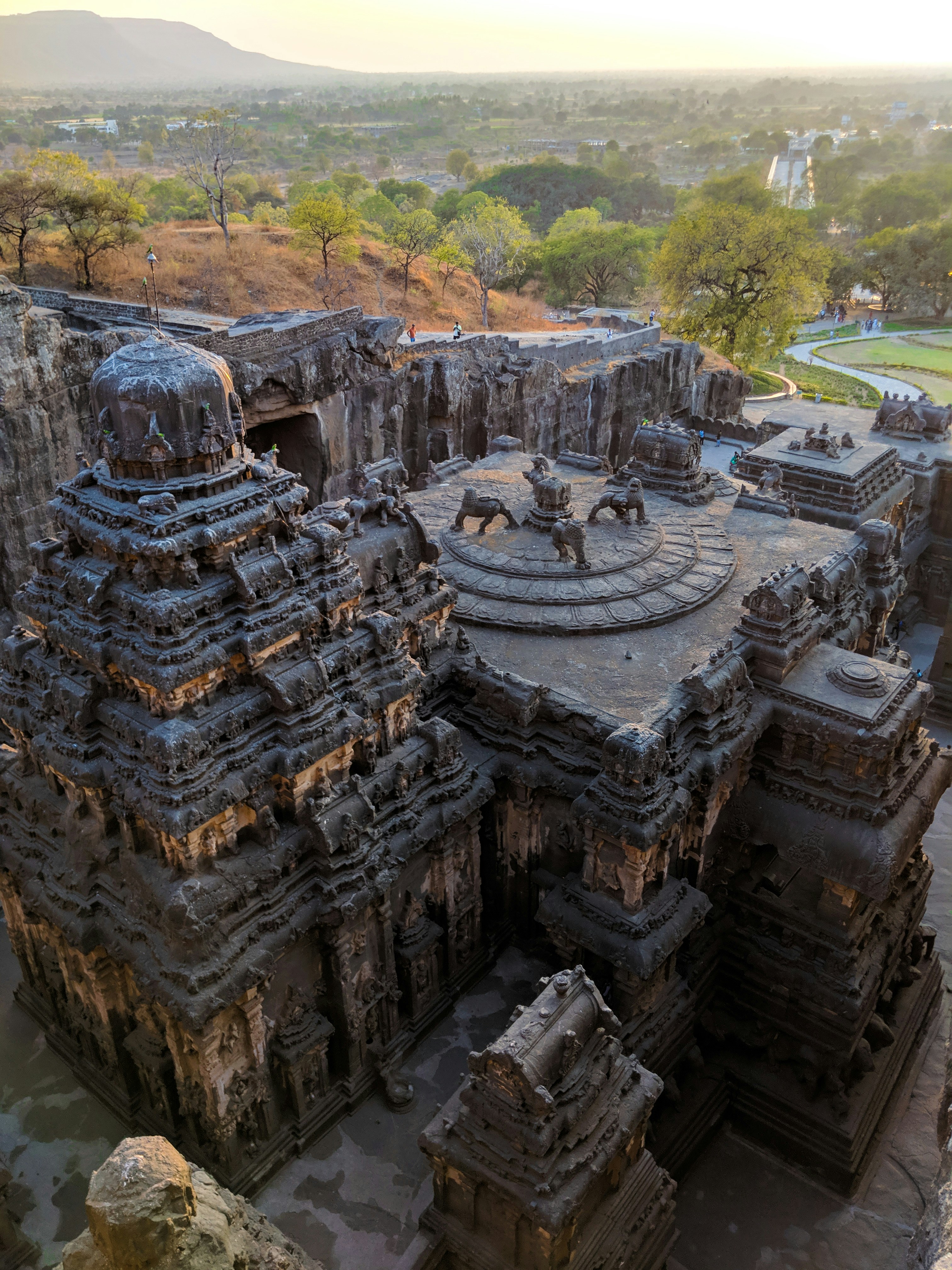 grey temple on hilltop overlooking the valley