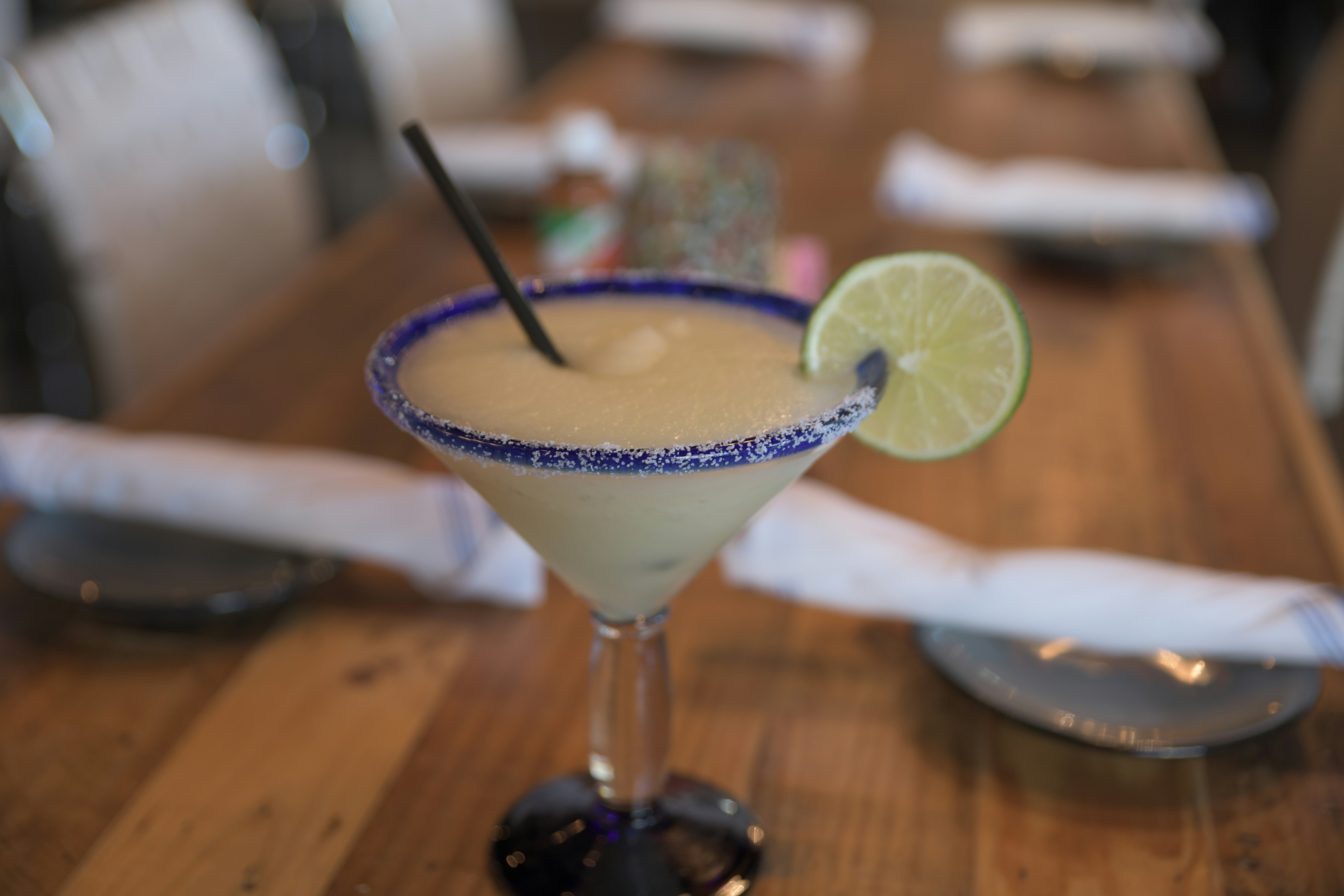 Frozen margarita with salt rim and lime wedge in a large glass at Hunters Nightclub Fort Lauderdale