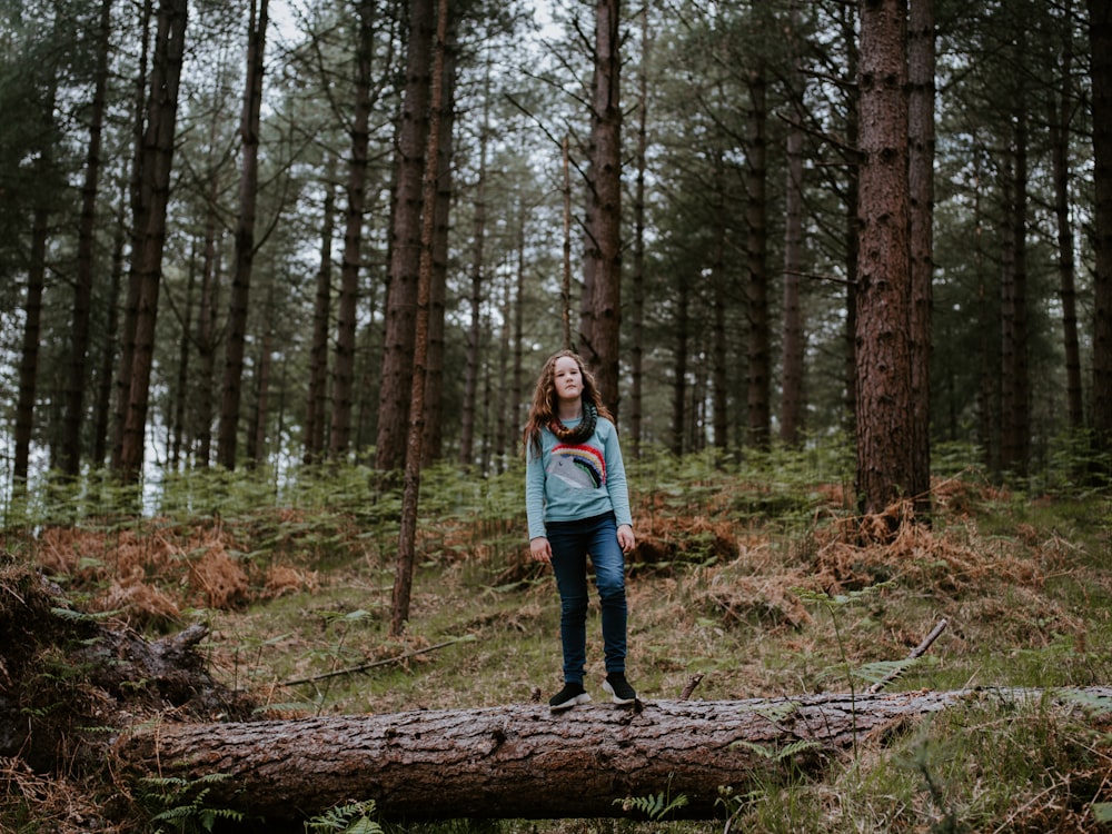 woman standing in forest