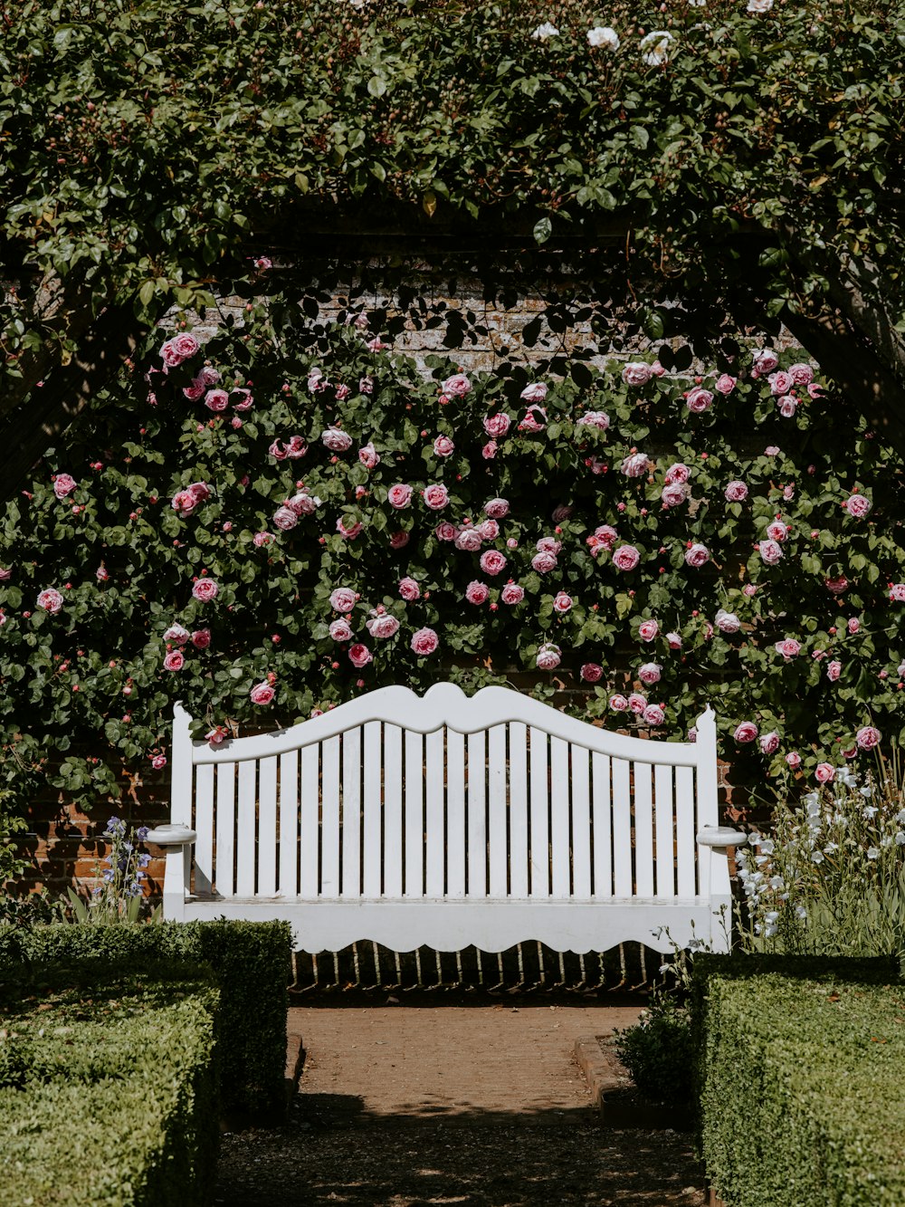 brown wooden gate covered with flowers