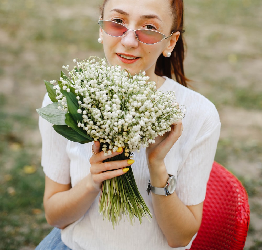 smiling woman holding flowers