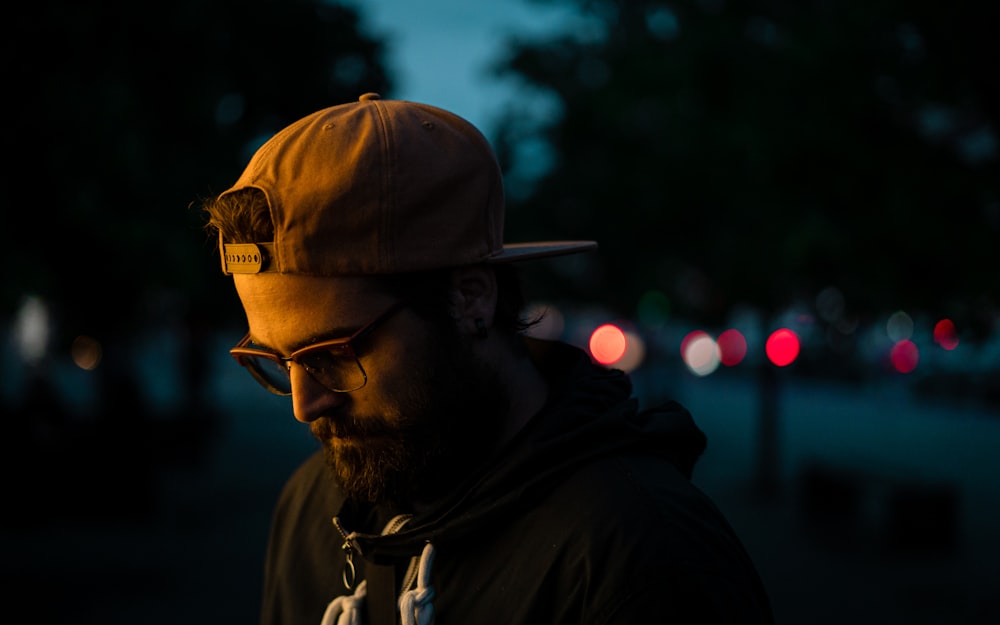 man wearing brown cap