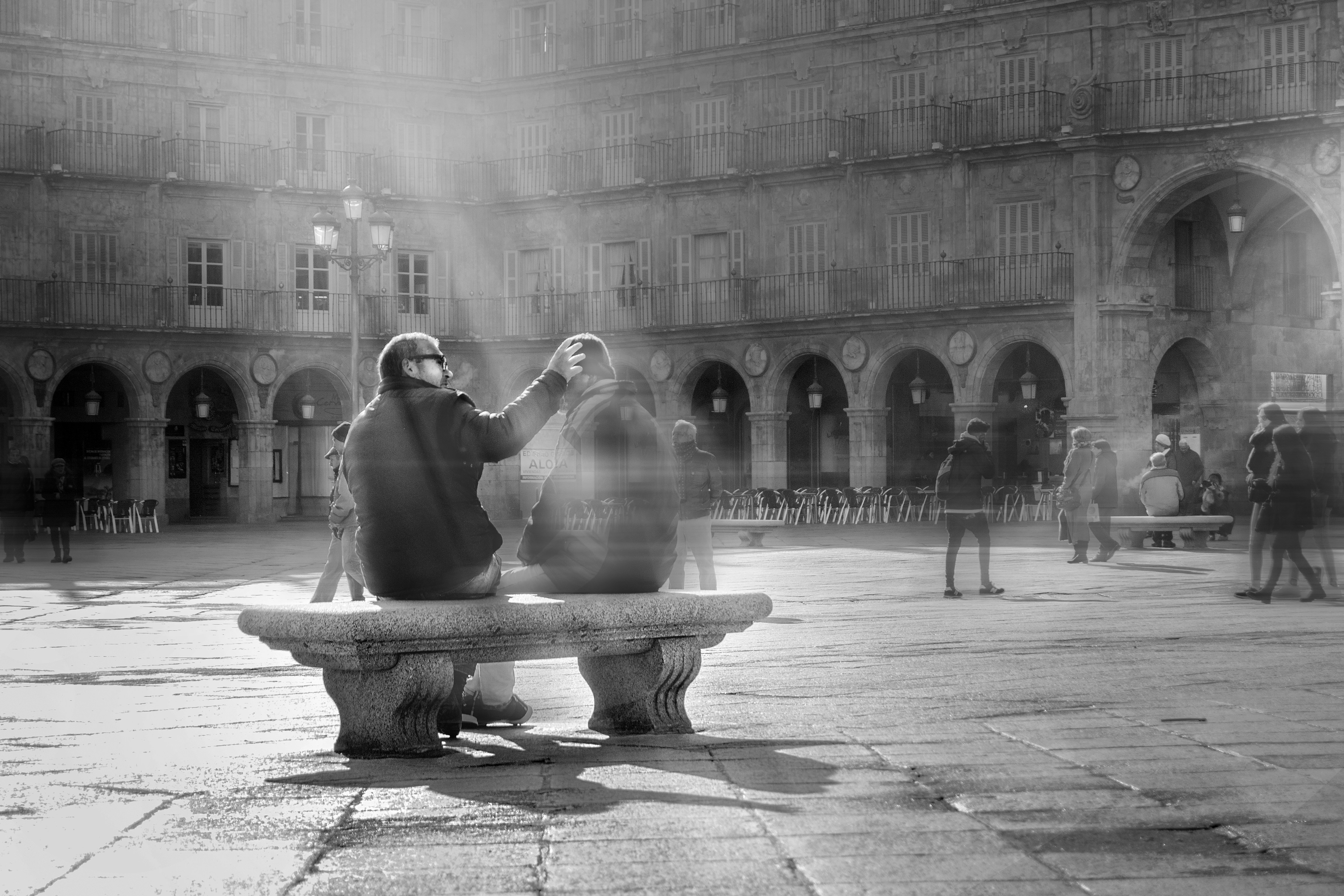 grayscale photography of person holding another person