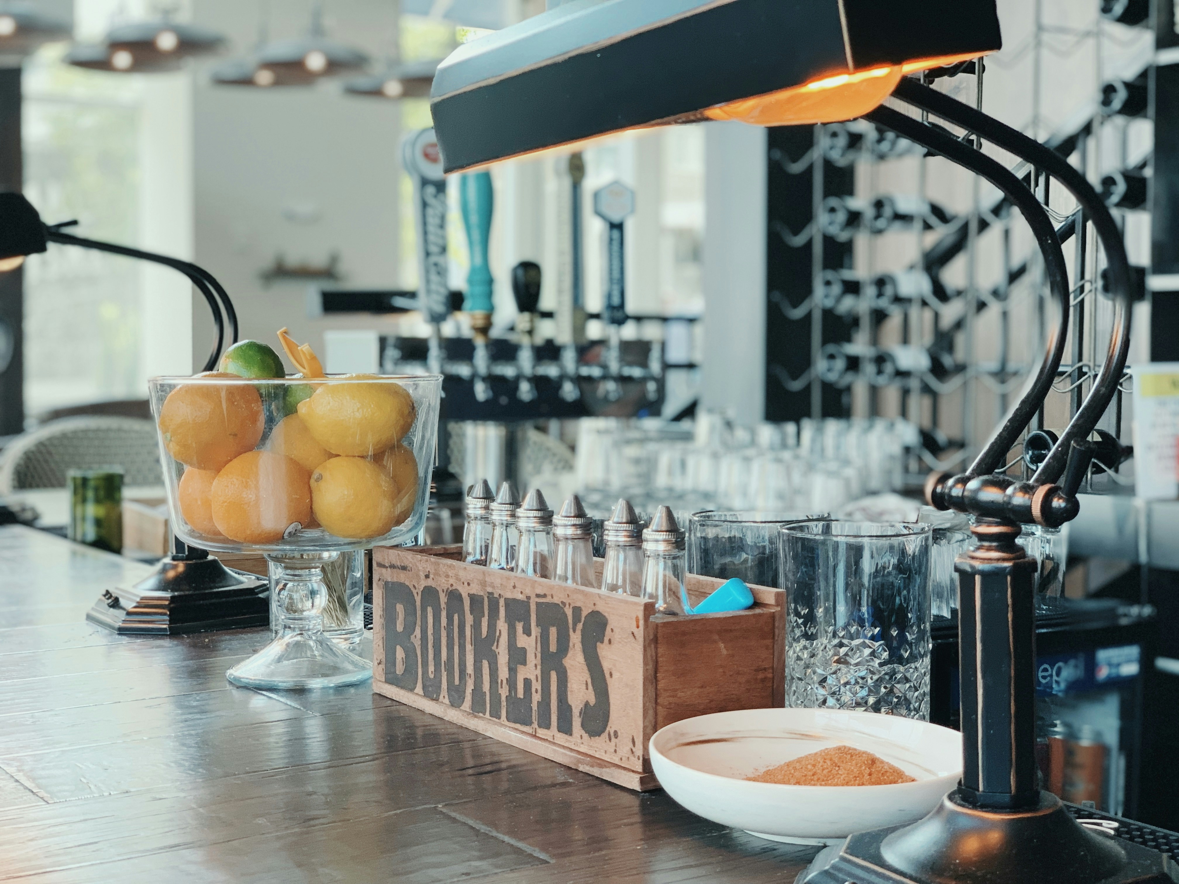 shallow focus photo of brown wooden rack on wooden table, Enjoyed bottomless mimosas at this cute bar in Nashville.