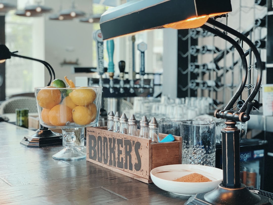 shallow focus photo of brown wooden rack on wooden table, Enjoyed bottomless mimosas at this cute bar in Nashville.