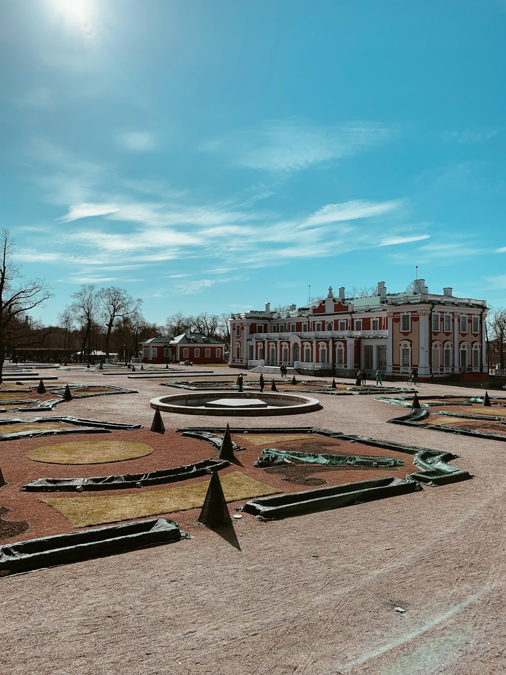 a large building with a fountain in the middle of it