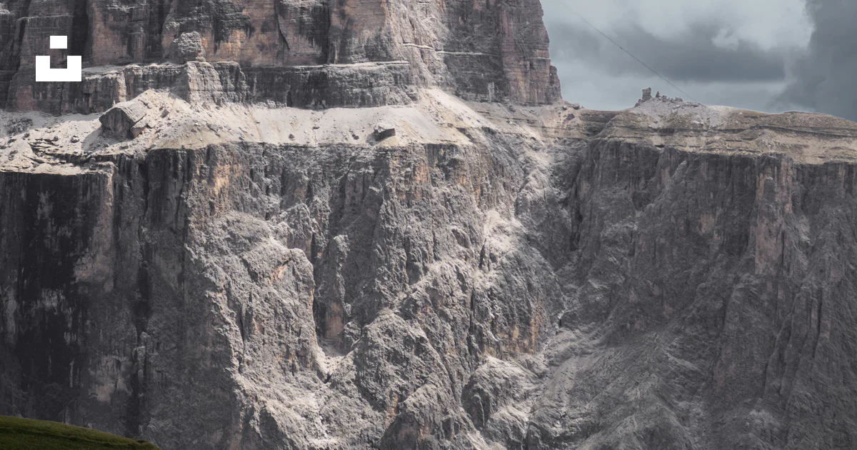 Grey rock mountain under cloudy sky photo – Free Grey Image on Unsplash