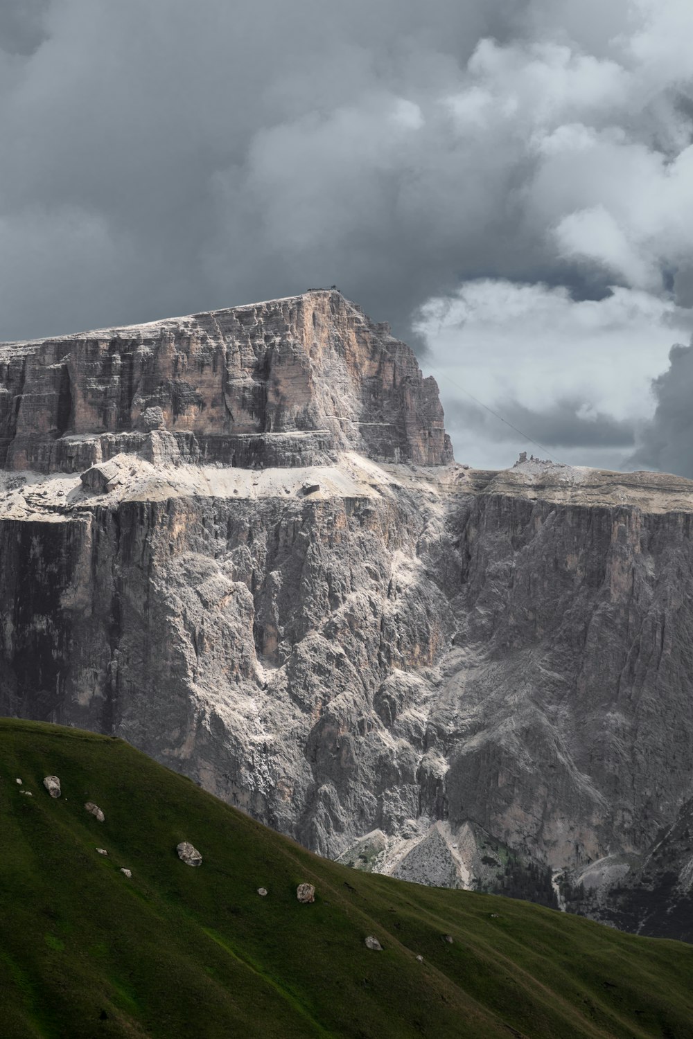 grey rock mountain under cloudy sky