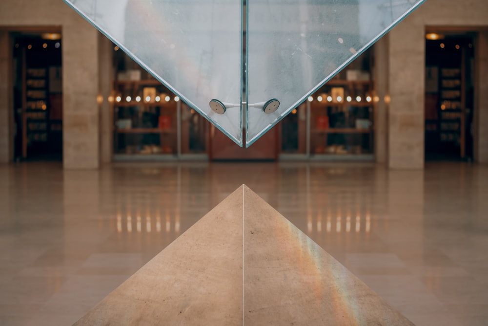 clear glass on top of concrete pyramid