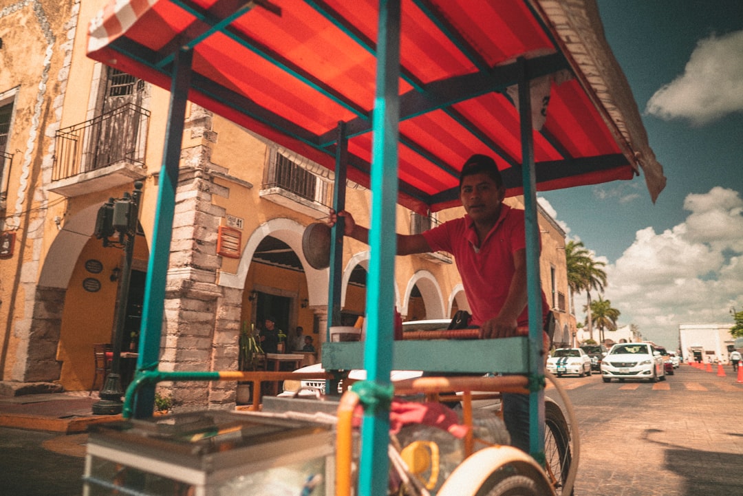 man push cart during daytime