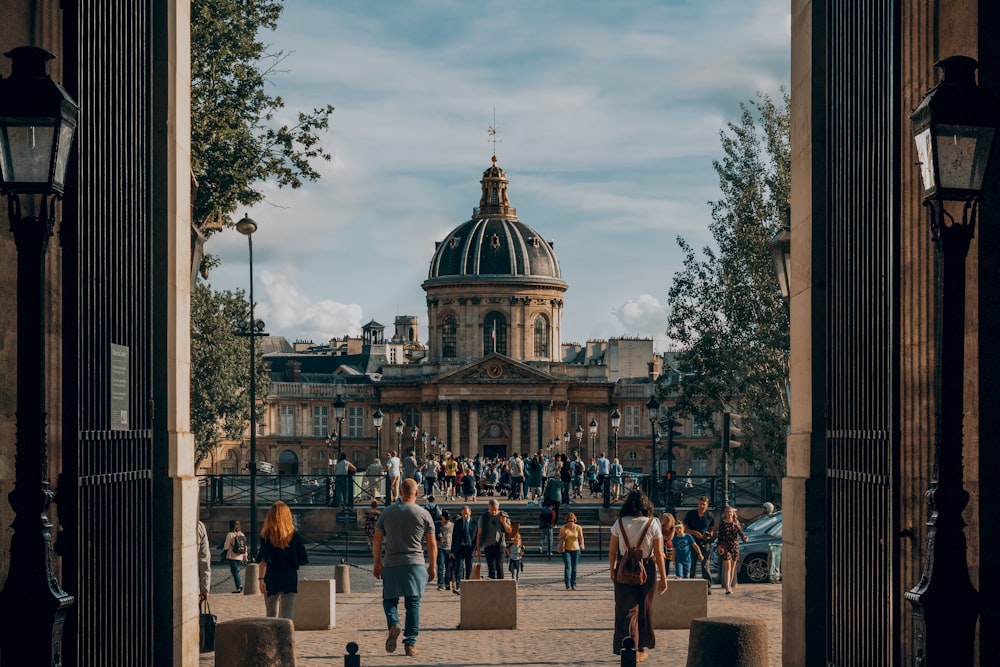 people on park in front of domed building