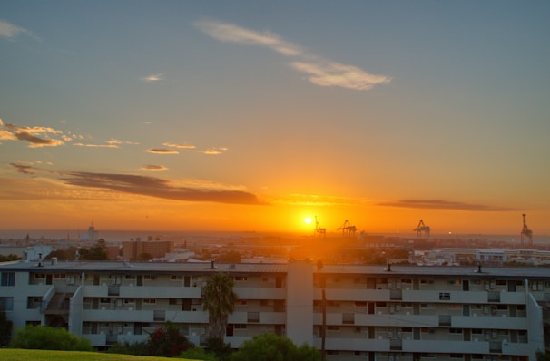 Photographer capturing a vibrant Houston neighborhood from a drone at sunset.