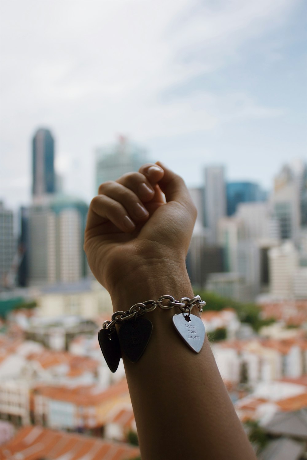 person wearing silver-colored bracelet