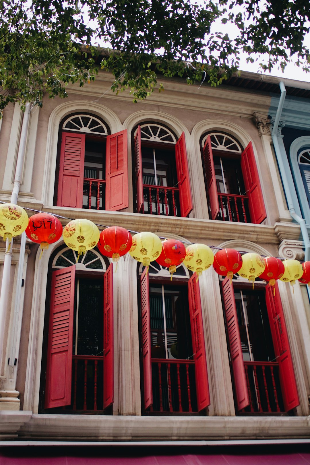 yellow and red ball lantern string outside building