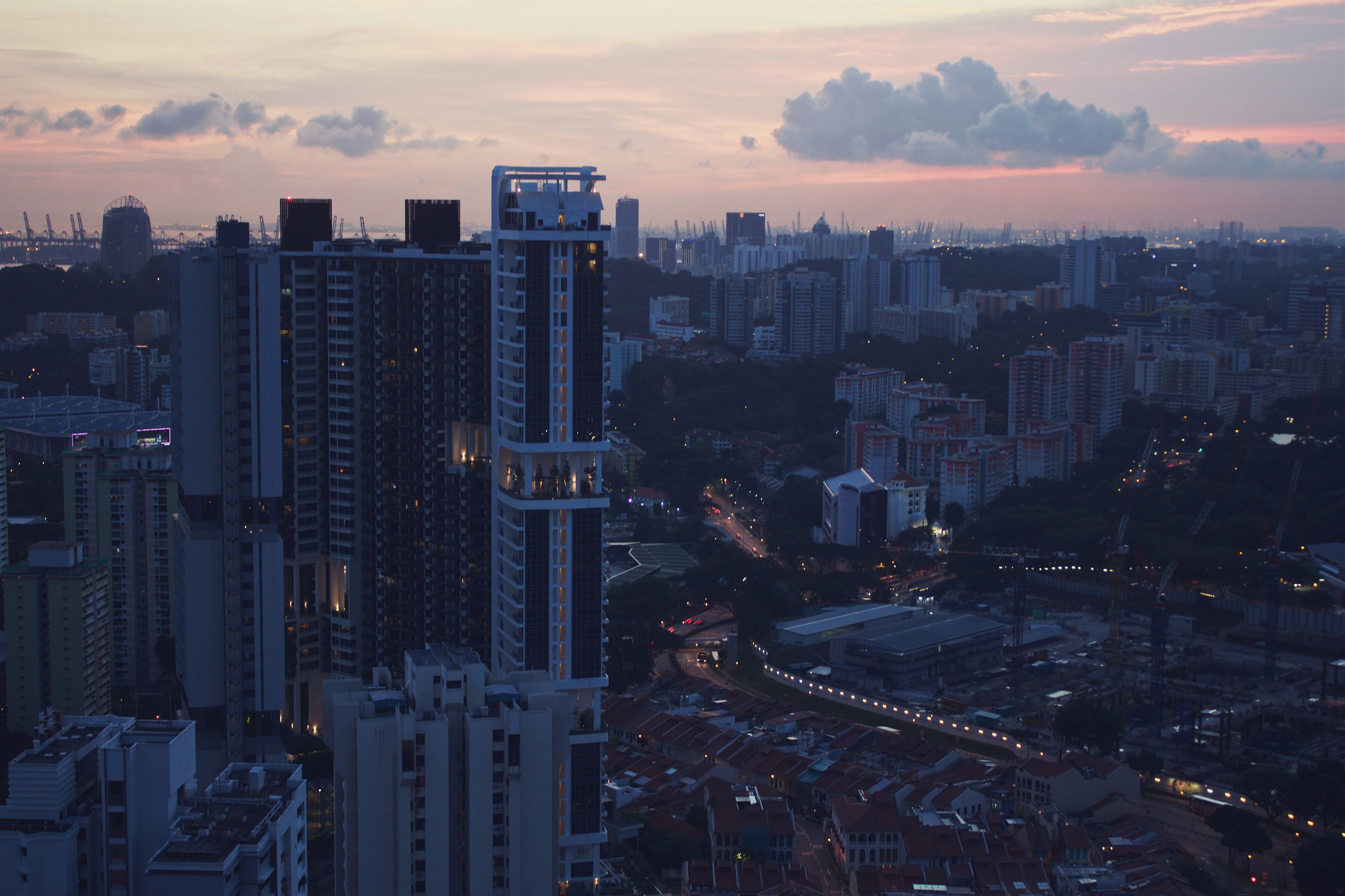grey and pink cloudy sunset sky over the city