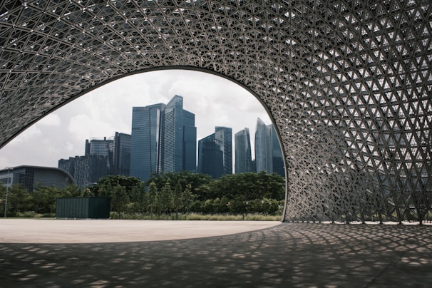 A modern city skyline blending afrofuturistic architecture with natural African landscapes.