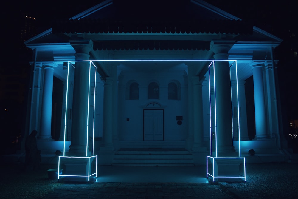 blue neon light in white building