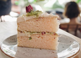 selective focus photo of white icing-covered cake slice