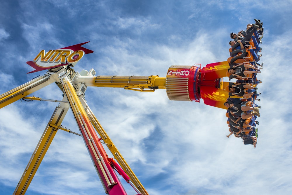 a carnival ride with people riding on it