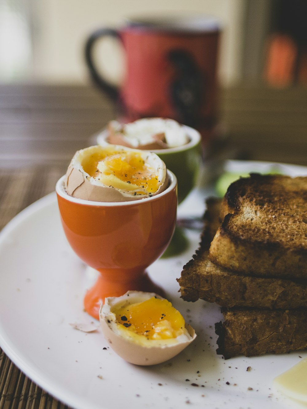 a white plate topped with eggs and toast