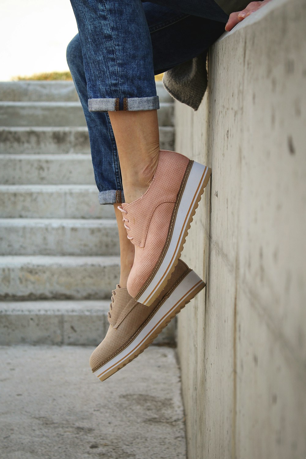 person wearing brown loafers