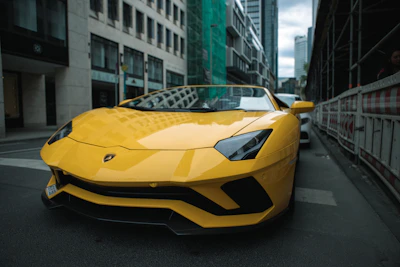 A sleek car ready for pickup in a sunny urban setting.