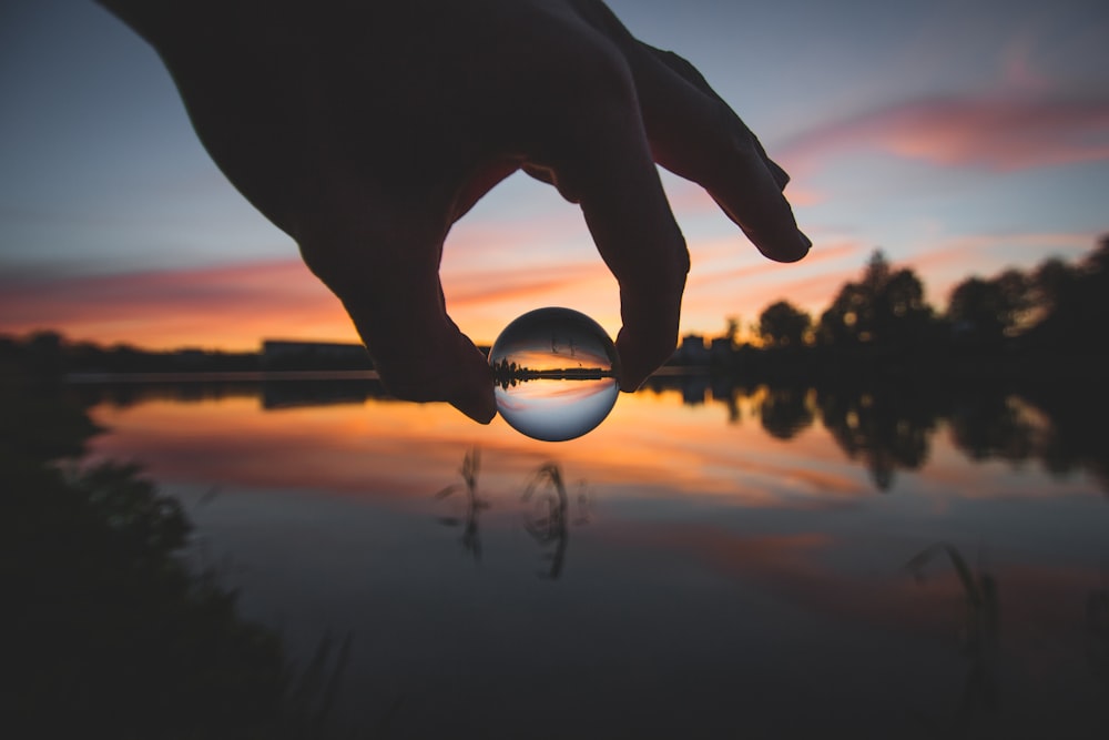 forced perspective photography of ball water