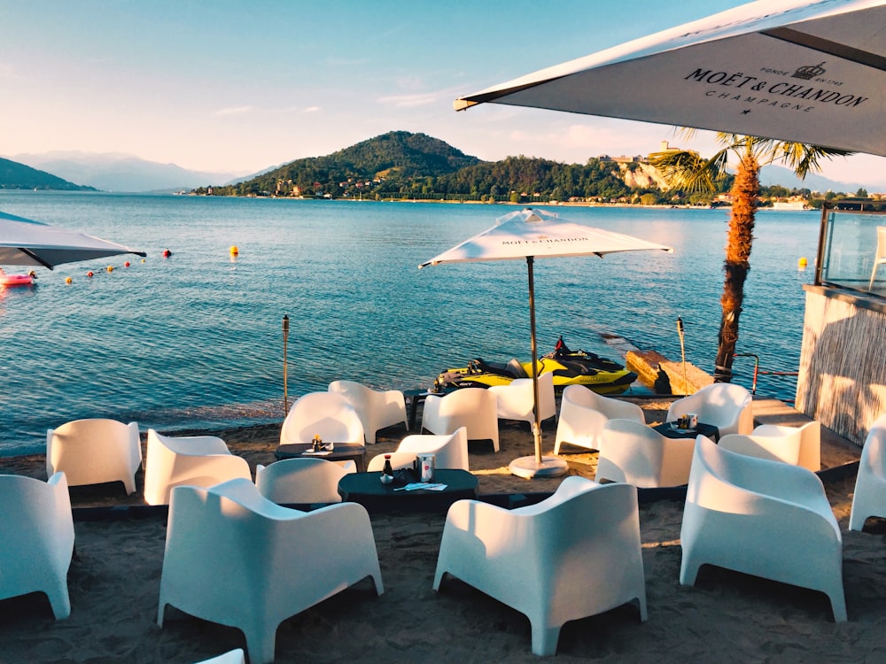 white chairs beside sea